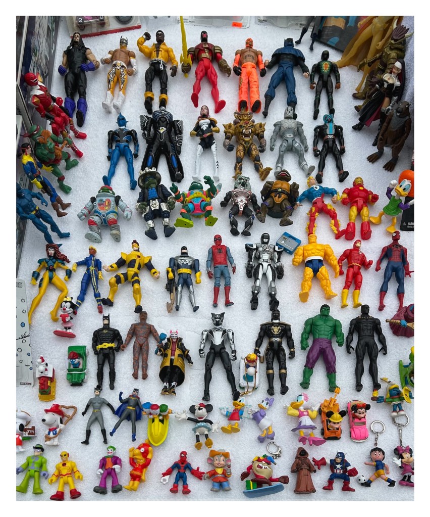 colorful action figures array on a white table