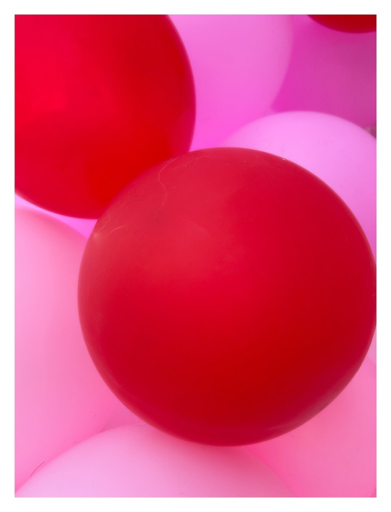 close-up of red and pink Valentine's Day balloons